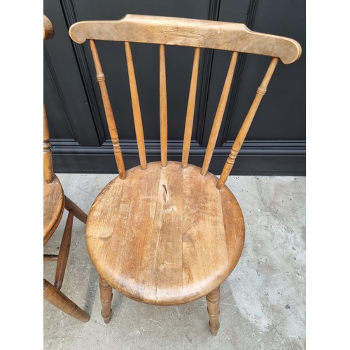 1159 - A pair of beech and elm kitchen chairs; and another. (3)