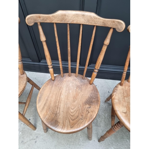 1159 - A pair of beech and elm kitchen chairs; and another. (3)