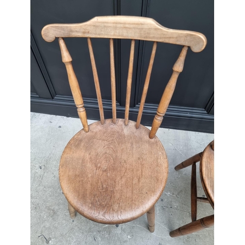 1159 - A pair of beech and elm kitchen chairs; and another. (3)