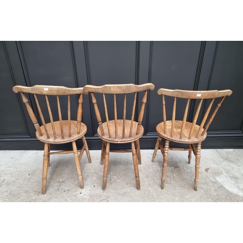 1159 - A pair of beech and elm kitchen chairs; and another. (3)