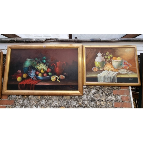 1162 - Hilario Roberto, still life of fruit, signed, oil on canvas, 59 x 98cm; together with another simila... 