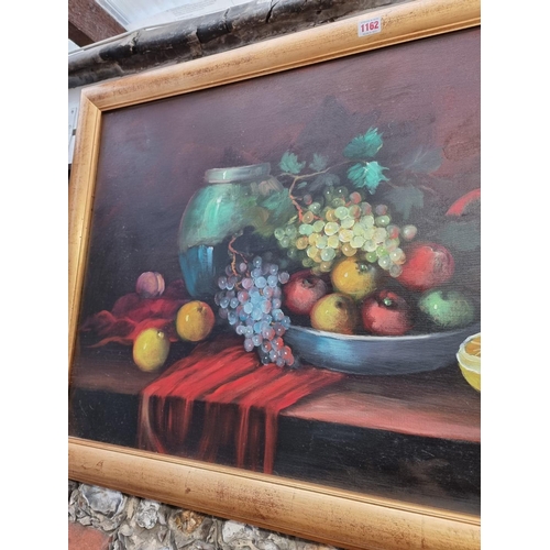 1162 - Hilario Roberto, still life of fruit, signed, oil on canvas, 59 x 98cm; together with another simila... 