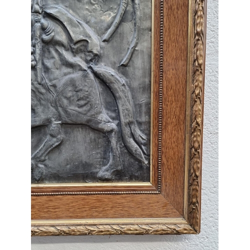 1175 - An antique zinc relief panel of St George, 58 x 48cm. 