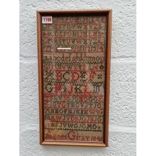 1199 - A Victorian needlework alphabet sampler, by 'Agnes Gilray, 1841', 40 x 19.5cm.  ... 