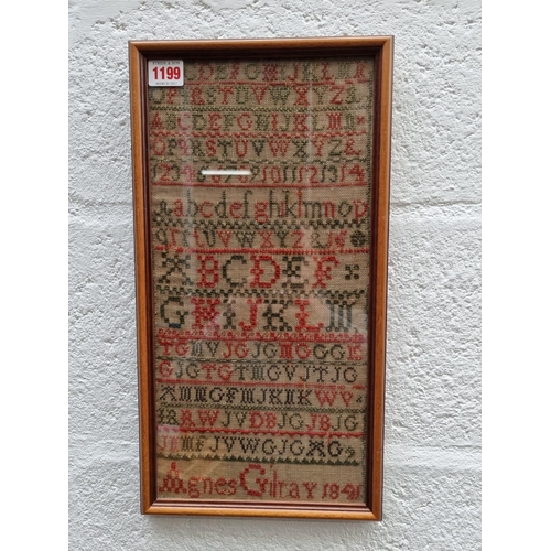 1199 - A Victorian needlework alphabet sampler, by 'Agnes Gilray, 1841', 40 x 19.5cm.  ... 