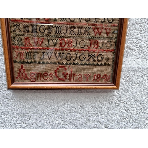 1199 - A Victorian needlework alphabet sampler, by 'Agnes Gilray, 1841', 40 x 19.5cm.  ... 