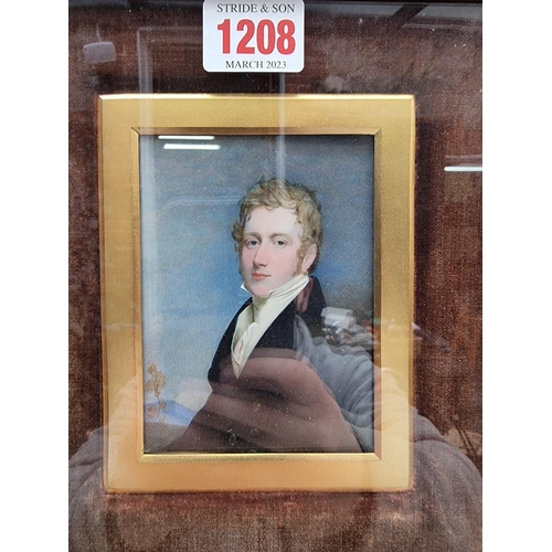 1208 - English School, first half 19th century, bust length portrait miniature of a gentleman, with blue ja... 