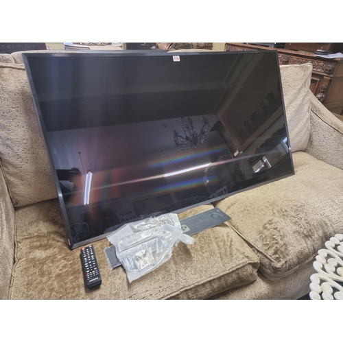 1255 - A Samsung 55in television, model no: UE55JU7000T, with remote control, (lacking stand and cables).... 