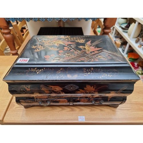 1256 - A Japanese lacquer casket, Meiji, decorated with birds, 39cm wide.