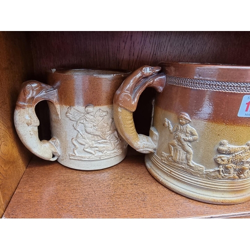 1257 - Two Victorian stoneware loving cups, largest 16.5cm high; and a similar tyg, (chips to each).&n... 