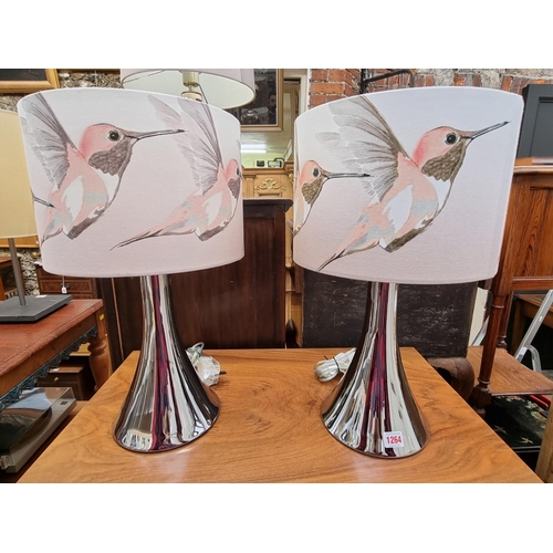 1264 - A pair of contemporary chrome table lamps, total height 51cm; together with another. (3)... 