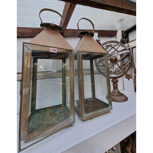 1268 - A large pair of brass lanterns, 74cm high; together with an armillary sphere. (3) ... 