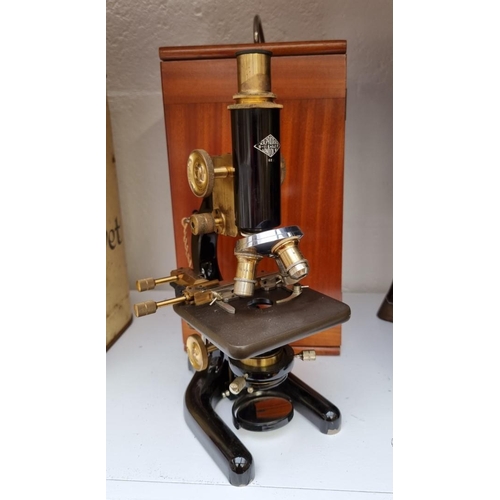 1273 - A 1930s W R Prior microscope, in mahogany case.