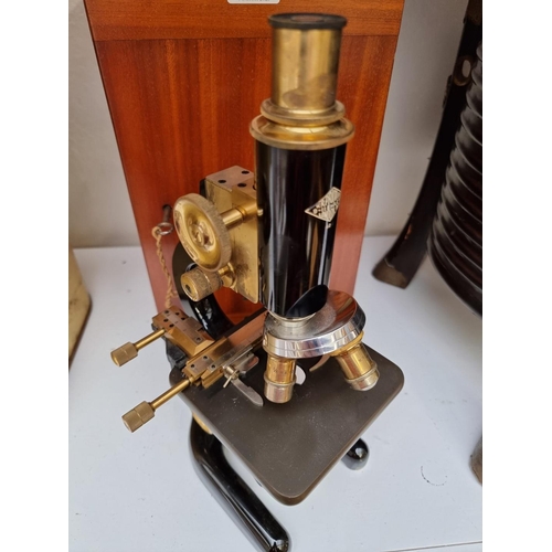 1273 - A 1930s W R Prior microscope, in mahogany case.