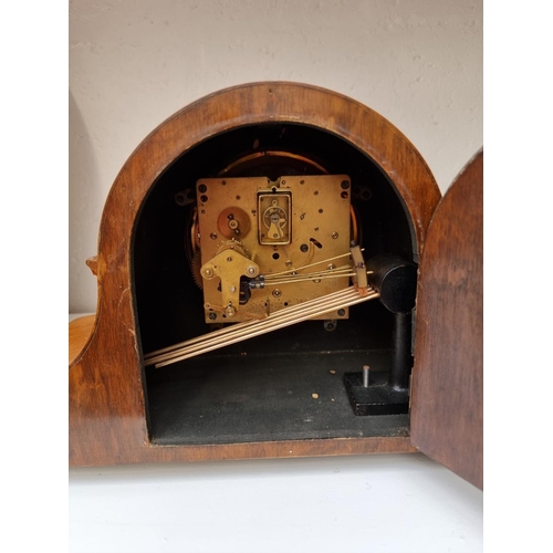 1278 - A 1930s walnut Wellington mantel clock, striking on five straight gongs, 41cm wide.