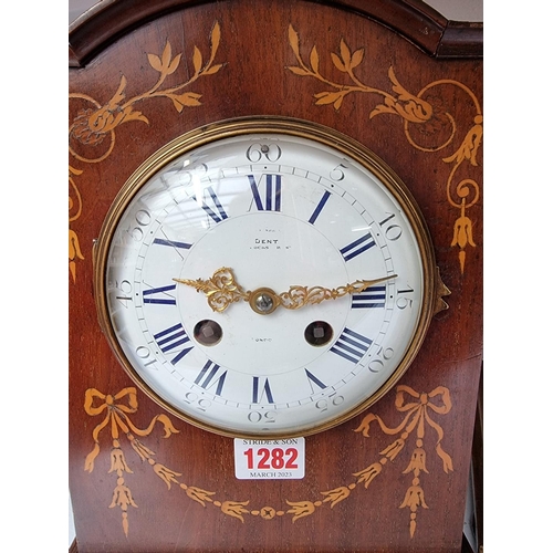 1282 - A late Victorian mahogany and inlaid mantel clock, the enamel dial inscribed 'Dent, London', strikin... 