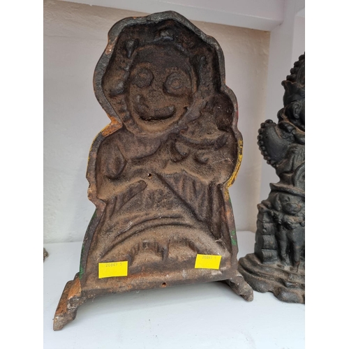 1285 - Two cast iron Punch and Judy door stops, largest 31cm high. 