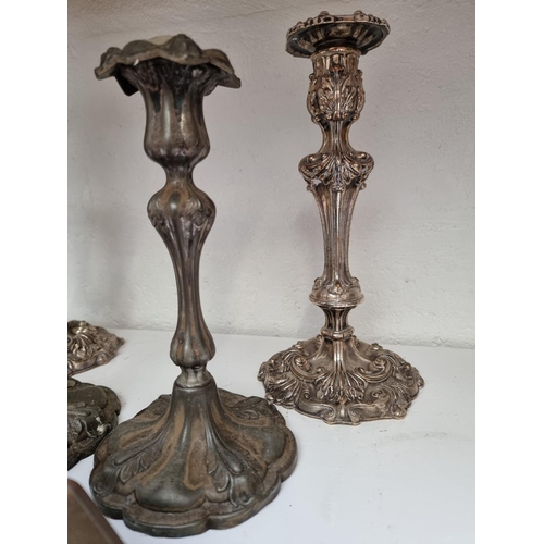 1286 - A pair of Old Sheffield plate candlesticks, 28.5cm high; together with another pair of candlesticks;... 