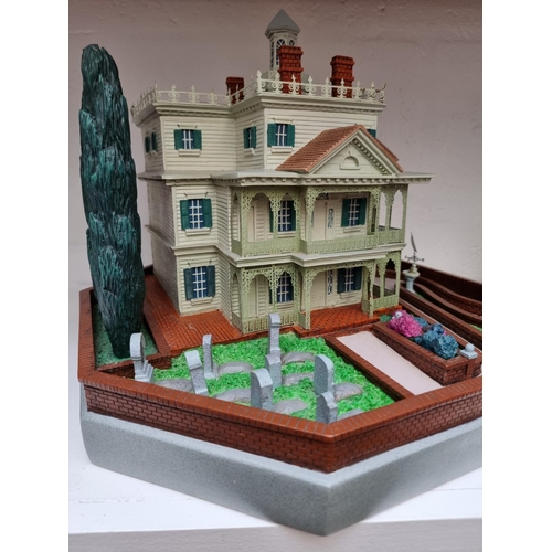 1287 - A Disneyland 'Magical Big Figurines' Haunted Mansion, 40cm wide.