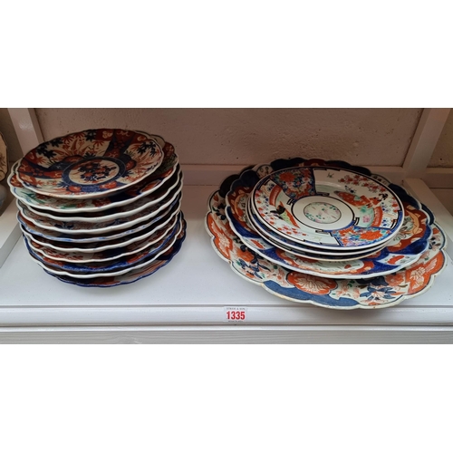 1335 - A collection of Japanese Imari plates and similar, largest 35cm diameter. (15)