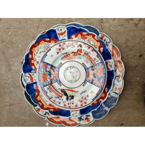 1335 - A collection of Japanese Imari plates and similar, largest 35cm diameter. (15)