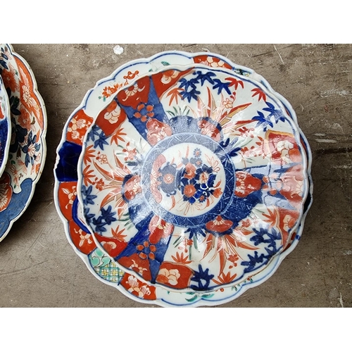 1335 - A collection of Japanese Imari plates and similar, largest 35cm diameter. (15)