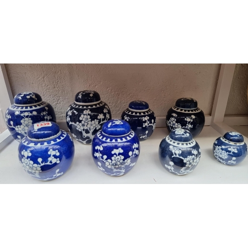 1339 - Eight Chinese blue and white ginger jars and covers, largest 15cm.