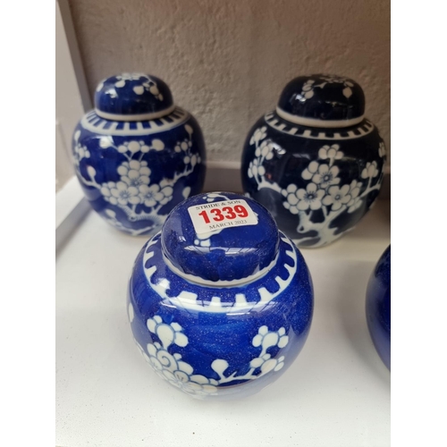 1339 - Eight Chinese blue and white ginger jars and covers, largest 15cm.