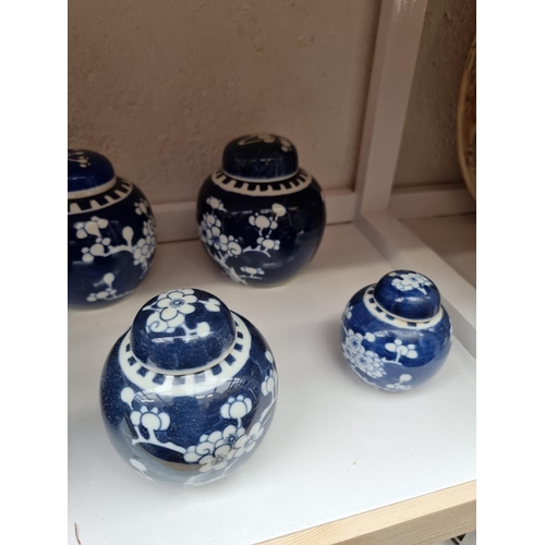 1339 - Eight Chinese blue and white ginger jars and covers, largest 15cm.