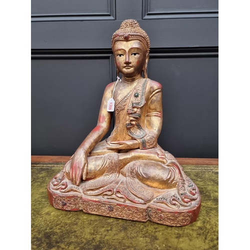 1355 - A large Chinese Sino Tibetan carved wood Buddha, with red lacquered and gilt decoration, 49cm high.&... 