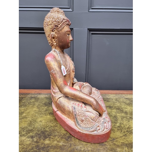 1355 - A large Chinese Sino Tibetan carved wood Buddha, with red lacquered and gilt decoration, 49cm high.&... 