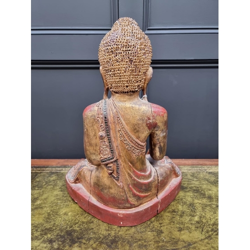 1355 - A large Chinese Sino Tibetan carved wood Buddha, with red lacquered and gilt decoration, 49cm high.&... 