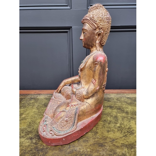 1355 - A large Chinese Sino Tibetan carved wood Buddha, with red lacquered and gilt decoration, 49cm high.&... 