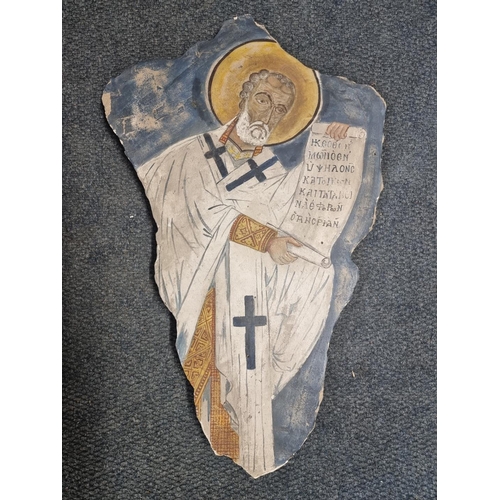 1615 - An antique painted sandstone wall fragment, probably Greek, painted with a saint, 62.5 x 40cm.... 