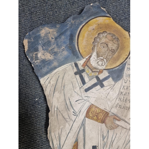 1615 - An antique painted sandstone wall fragment, probably Greek, painted with a saint, 62.5 x 40cm.... 