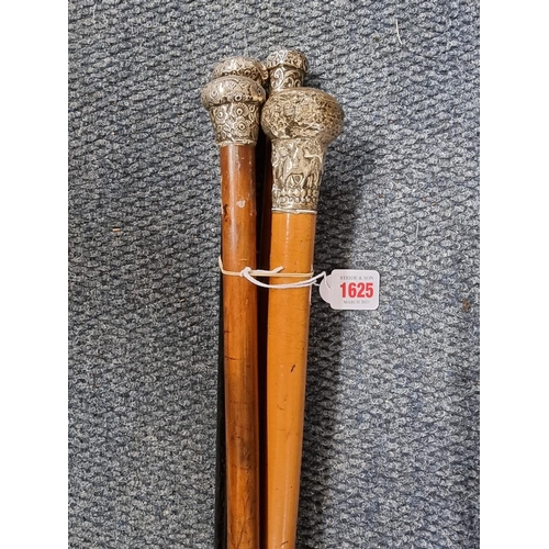 1625 - Four silver mounted canes. 