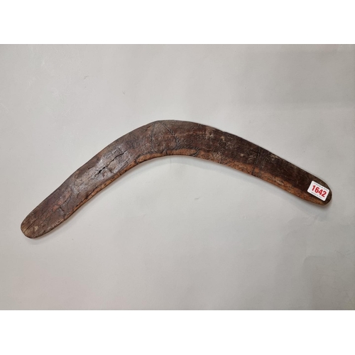 1642 - Ethnographica: a Boomerang, with engraved decoration, 52cm wide. 