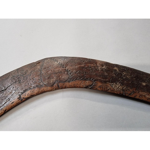 1642 - Ethnographica: a Boomerang, with engraved decoration, 52cm wide. 