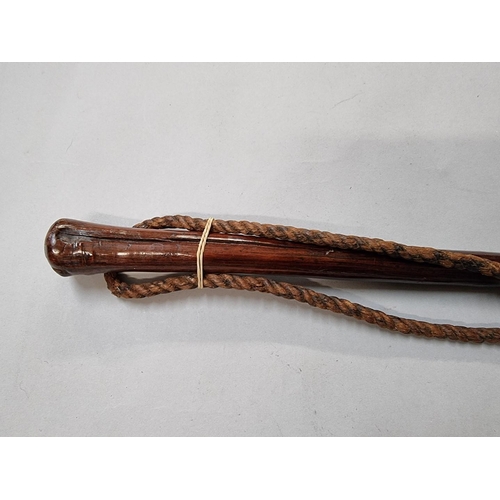 1643 - Ethnographica: a wood and rope whip, the handle 60.5cm long.