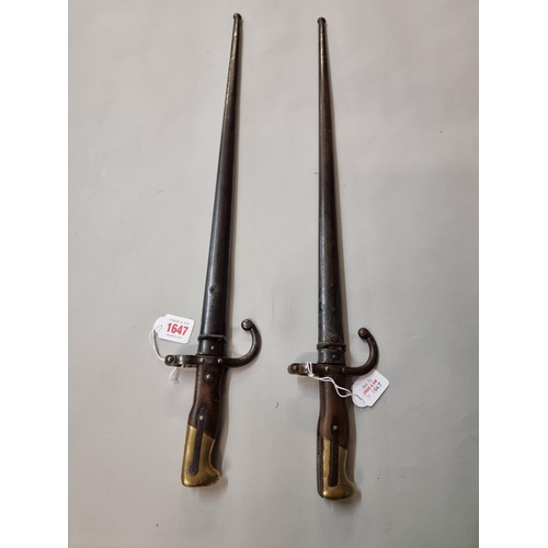 1647 - Two French T back bayonets and scabbards, dated 1875 and 1877, both marked St Etienne and numbered 1... 