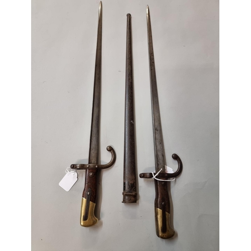 1648 - Two French T back bayonets and one scabbard, one dated 1878, marked St Etienne, the other indistinct... 