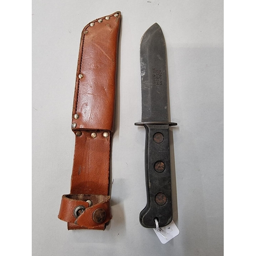 1653 - A British Army survival knife and leather sheath, with broad arrow.