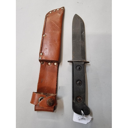 1653 - A British Army survival knife and leather sheath, with broad arrow.