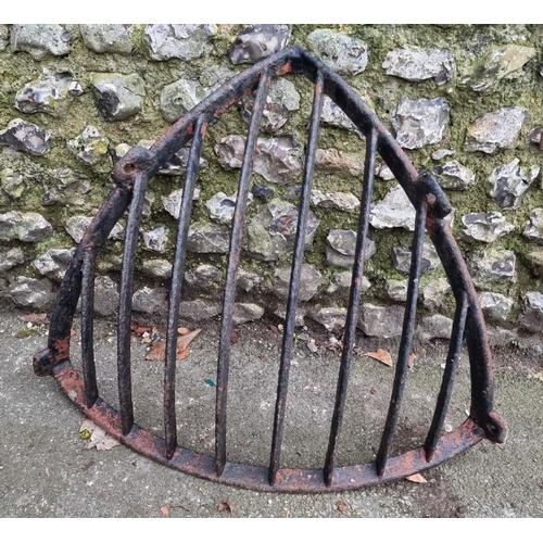 1677 - A Victorian black painted cast iron corner hay feeder, 87cm wide.