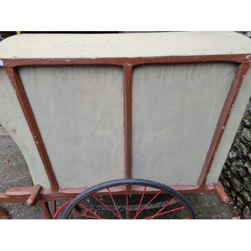 1680 - An antique covered market seller's apple cart or barrow, total length 163cm x 122cm high, wheelbase ... 