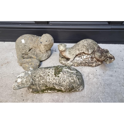 1689 - Three composition stone garden animals, comprising a badger and two otters, largest 40cm wide.... 