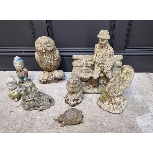 1691 - Eight composition stone garden figures, to include three owls and two gnomes, largest 41cm high.... 