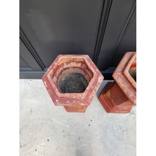 1702 - A pair of old red composition stone hexagonal chimney pot style planters, 62cm high x 36cm wide.... 