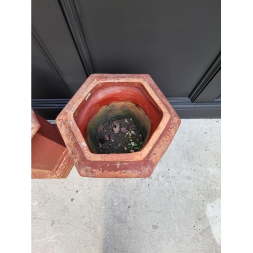 1702 - A pair of old red composition stone hexagonal chimney pot style planters, 62cm high x 36cm wide.... 