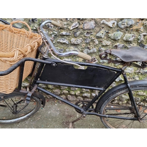 1704 - A vintage Raleigh tradesman's bicycle, with wicker basket to front pannier.